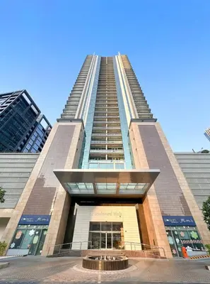 a tall building with a large staircase in front of it at FIRST CLASS Studio Downtown Bliss Urban Gem in Dubai