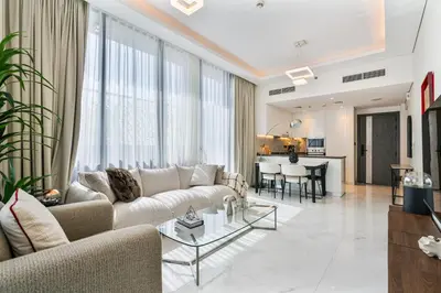 a living room with a couch and a table at Venetian - Relax in your private pool balcony in Dubai in Dubai