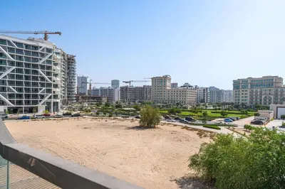 a beach in the middle of a city with buildings at Venetian - Relax in your private pool balcony in Dubai in Dubai