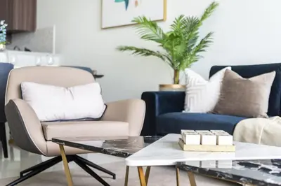 a living room with two chairs and a coffee table at GuestReady - Sea view retreat overlooking The Palm in Dubai