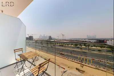a balcony with a view of a highway at Chic 1BR with Canal View in Dubai