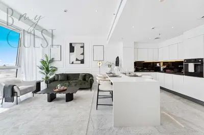 a kitchen and living room with a couch and a table at Remarkable one BR in Business Bay with Canal View in Dubai