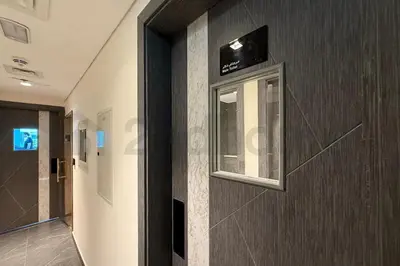 a hallway with a wall with a window on it at Luxury at Its Finest, 2BR with Private Indoor Pool in Dubai