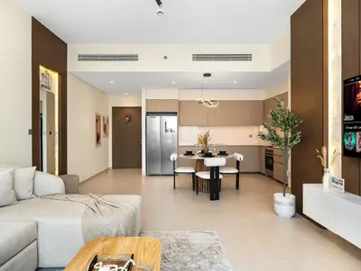 a living room with a couch and a table at Spacious, Modern Chic 2 BDR Apartment in Prime Downtown Location in Dubai
