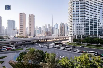 a highway in a large city with cars and buses at Luxury Escapes Modern 1 Bed Apt City View Sol Bay Business Bay in Dubai