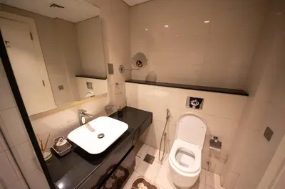 a bathroom with a toilet and a sink at Mejestic Studio in Dubai