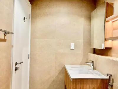 a bathroom with a sink and a shower at Homes2Retreat - Modern Comforts 1 BR in Liva Lush Living in Dubai