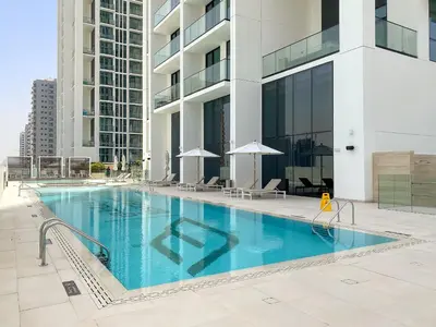 a swimming pool in the middle of a building at VayK - Stylish Bright 1BR in JVC in Dubai