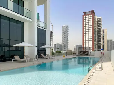 a large swimming pool on top of a building at VayK - Stylish Bright 1BR in JVC in Dubai