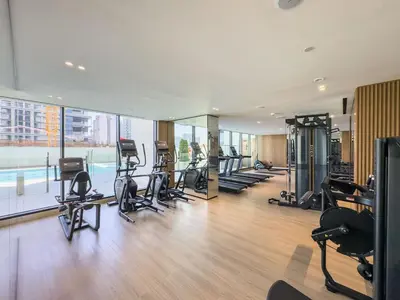 a gym with treadmills and exercise equipment in a building at DAYF-LAV Brand New Apartment with Balcony in JVC in Dubai