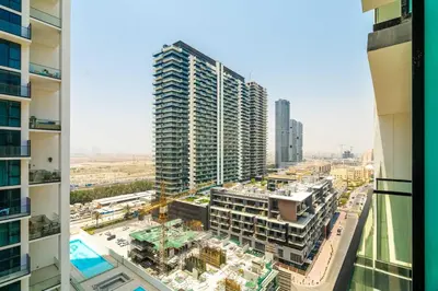 an aerial view of a city with tall buildings at DAYF-LAV Brand New Apartment with Balcony in JVC in Dubai