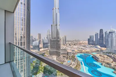 a view of a city from a balcony of a building at FAM Living Grande 2Bed with Panoramic Burj Khalifa Fountain View in Dubai