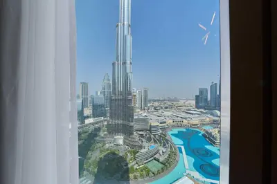 a view of the burj khalifa from a hotel room at FAM Living Grande 2Bed with Panoramic Burj Khalifa Fountain View in Dubai