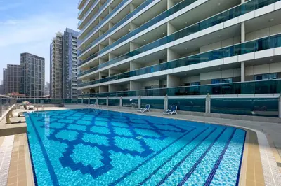 a large swimming pool on the roof of a building at Elite Studio Retreat in Business Bay District in Dubai