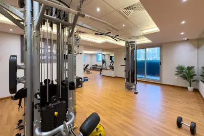 a gym with exercise equipment in a building at Elite Studio Retreat in Business Bay District in Dubai