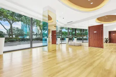a large room with a wooden floor and large windows at FIRST CLASS 2BR Sky Views City Vibes in Dubai