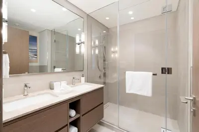 a bathroom with a sink and a shower at Grande, Luxurious 2 BR, Burj Khalifa & Fountain view in Dubai