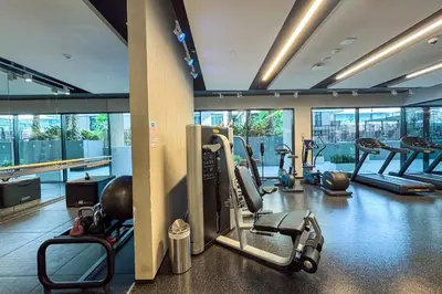 a gym with treadmills and ellipticals in a building at Art-Inspired 1 Bedroom in Wilton Terraces in Dubai