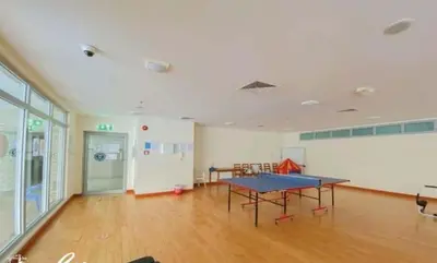 an empty room with a ping pong table in it at Stunning 1Bedroom Apartment 5 min walking distance Metro and JBR Beach in Dubai
