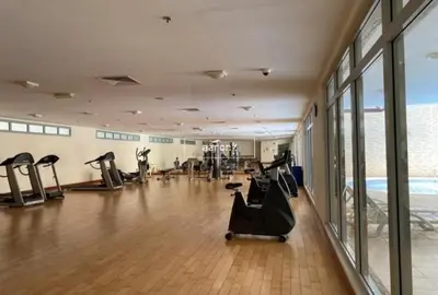 a gym with treadmills and exercise equipment in a building at Stunning 1Bedroom Apartment 5 min walking distance Metro and JBR Beach in Dubai