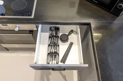 a drawer in a kitchen with utensils in it at Stylish 1BR in Marina - 5 Min Walk to Beach in Dubai