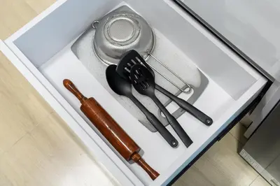 a group of utensils sitting on a white table at Luxurious JVC Studio Near Circle Mall & Parks in Dubai