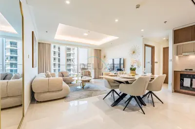 a living room with a table and chairs at 1BR With Private Beach Access, Near Dubai Marina Walk, Next to Dubai Harbour Marina & Yacht Club, Palace Beach Residence, Dubai Marina by Deluxe Holiday Homes in Dubai
