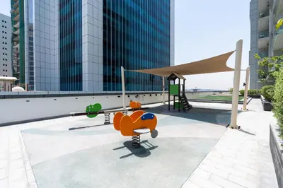 a toy dog on a skateboard in front of a building at Ahlan HH - Stylish Suite Heart of Business Bay Avanti Tower in Dubai