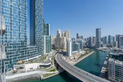 a view of a city with a river and buildings at Vogue Marina 52-42 Towers near Ain Dubai and JBR Beach, Two Bedroom Apartment with Balcony Canal and Skyline views, Access to all Amenities in Dubai