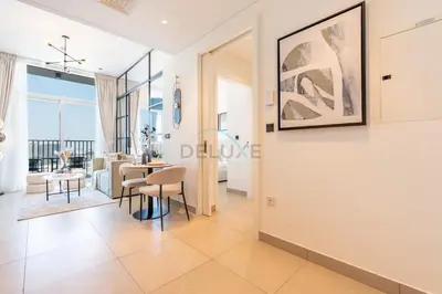a view of a living room and dining room at Located Minutes walk to Dubai Hills Park, Near Dubai Hills Mall , Socio Tower 1, Dubai Hills by Deluxe Holiday Homes in Dubai