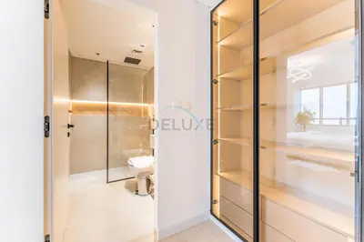a glass shower door in a bathroom with a toilet at Golf Course And Canal Views, Mins to Dubai Marina And Dubai Mall, Golf Towers T1 - The Greens by Deluxe Holiday Homes in Dubai