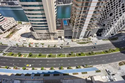 an aerial view of a city with tall buildings at Art Studio - Cozy Loft, Fireplace, City Vistas in Dubai