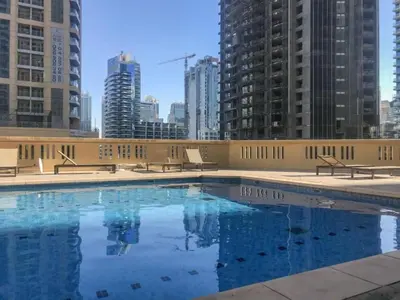 a swimming pool on the roof of a building at Vacationer I Royale 3 Bedroom I Steps to JBR Beach I Jumeirah I Free Gym, Pool, Parking & Wi-Fi in Dubai