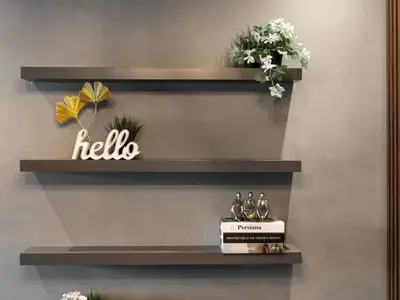 a shelf with a hello sign on a wall at Luxury 1 Bedroom Marina Views Walk to Metro and Beach in Dubai