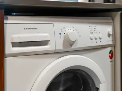 a white washer and dryer in a room at Luxury 1 Bedroom Marina Views Walk to Metro and Beach in Dubai