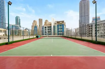 a tennis court in the middle of a city at Luxury 2 BHK in Dubai Marina By dPie DEC 1907 in Dubai