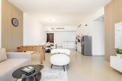 a living room with a couch and a table at Lux 3BHK in Dubai Marina w Marina View DEC 1407 in Dubai