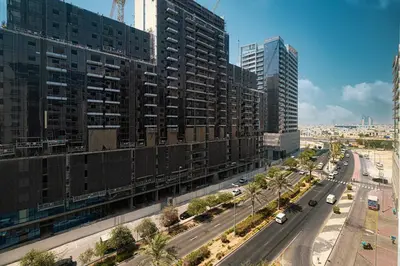 an aerial view of a city with tall buildings at Luxury 1 BHK in Jumeirah Village Circle BydPie Concept 302 in Dubai