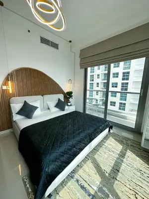 a bedroom with a large bed and a large window at Luxury 3BHK in Dubai Marina DEC 1603 in Dubai