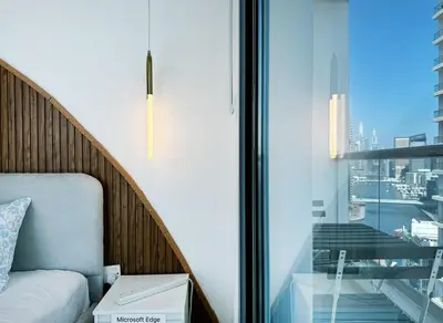a bedroom with a window with a view of a city at Luxury 3BHK in Dubai Marina DEC 1603 in Dubai