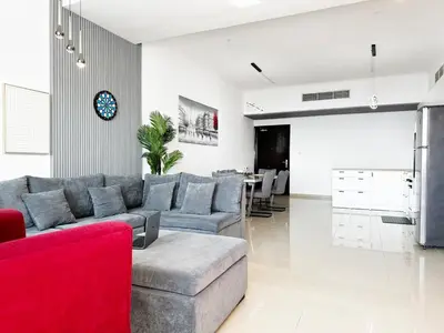 a living room with a couch and a table at Luxury 3BHK in Dubai Marina DEC 1603 in Dubai