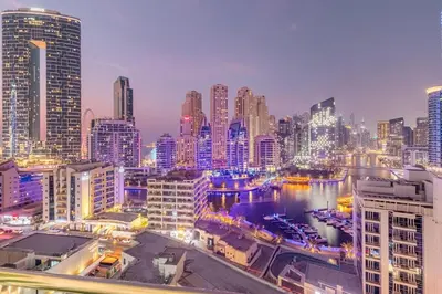 a view of a city skyline at night at Luxury 3 BHK in Dubai Marina By dPie Dec 1007 in Dubai
