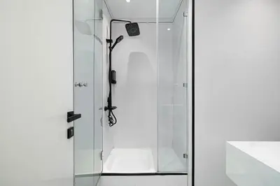 a shower with a glass door in a bathroom at Luxury 3BHK in Dubai Marine By dPie DEC 903 in Dubai
