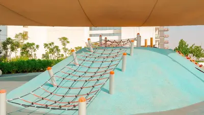 a slide at a resort with at KeyRock Living - Golf Gate Apt with Pool Access in Dubai
