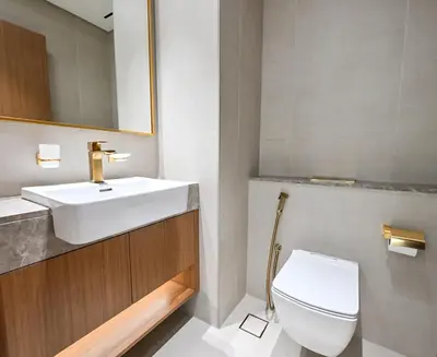 a bathroom with a sink and a toilet at Golden Stays - Binghatti Amber I Modern 1BR Apartment I Balcony, Pool & Gym Access in Dubai