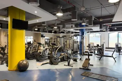 a gym with treadmills and elliptical machines at Lovely 1BR Apartment Bahar 6 JBR in Dubai