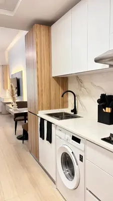 a kitchen with a washer and dryer at Best Sunrise Holiday Home in Dubai