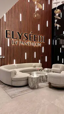 a living room with a couch and two chairs and tables at Best Sunrise Holiday Home in Dubai