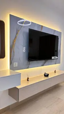 a large flat screen tv on a wall at Best Sunrise Holiday Home in Dubai