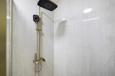 a shower with a shower head in a bathroom at Lux 2BHK w Marina view w Sky Light Mesk 2007 in Dubai